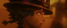 a close up of a person wearing a hat in a dark room .