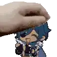 a hand is petting a cartoon character with blue hair and a tongue sticking out .