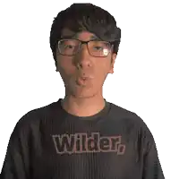 a man wearing glasses and a shirt that says wilder on it