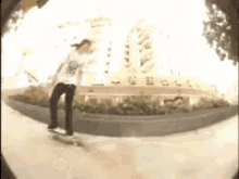 a person is riding a skateboard in front of a building that says ' a ' on it