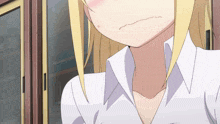 a close up of a girl 's neck with a white shirt on