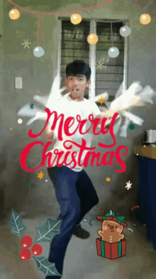 a boy is dancing in front of a merry christmas greeting