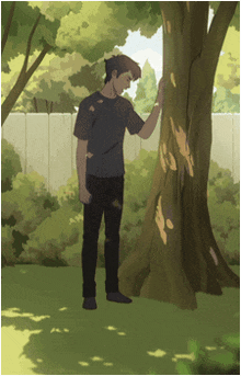 a man standing next to a tree with a white fence behind him