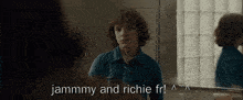 a man looking at himself in a mirror with the words jammmy and richie fr written above him