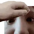 a close up of a person 's face with a hand holding a piece of paper over it .