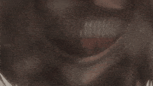 a close up of a cartoon character 's mouth with a skull behind it