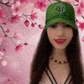 a girl wearing a green hat with a basketball logo on it
