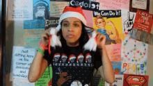 Lilly Singh Vlogmas GIF - Lilly Singh Vlogmas Santa Hat Braid GIFs