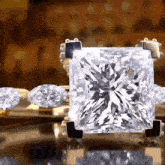 a diamond ring with a square cut diamond in the center