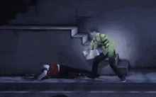 a man in a green jacket is standing on a set of stairs while another man is laying on the ground .