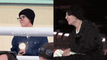 a man wearing glasses and a beanie is sitting next to another man wearing glasses and a black jacket ..