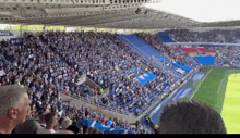 a large crowd of people are watching a soccer game in a stadium with a banner that says ' dacia '