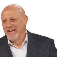 a bald man with a beard is smiling and wearing a plaid jacket