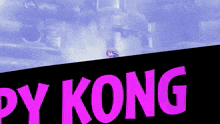 a poster for py kong shows a man standing on a ledge