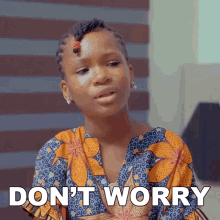 a girl in a blue and orange shirt says " do n't worry "