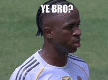 a soccer player with a braided mohawk and the words ye bro on his head