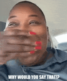 a woman with red nails is covering her mouth with her hand and the caption why would you say that