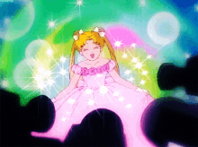 a girl in a pink dress is surrounded by a crowd of people