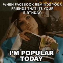 a woman is reading a book and says i 'm popular today