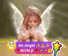 a little girl with angel wings sits on the ground