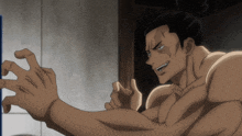 a man with a ponytail is looking at himself in the mirror