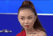 a woman in a red dress is on a television show called boy abunda