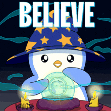 a penguin wearing a wizard hat holds a crystal ball in front of a sign that says believe