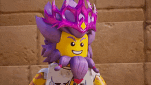 a lego man with purple hair and a crown on his head