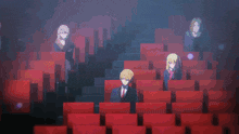 a group of anime characters are sitting in a dark auditorium