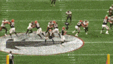 a football game is being played on a field that says stop hate on it