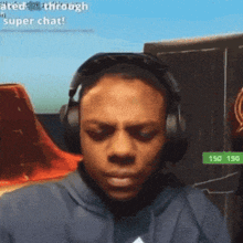 a man wearing headphones with the words super chat on the bottom left