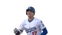 a baseball player wearing a dodgers jersey and helmet