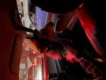 a dog is wearing a leash in a car with a sign that says ' a ' on it