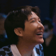 a close up of a person 's face with a laughing expression
