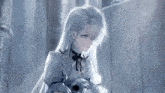 a girl with long white hair is holding her head in her hand .