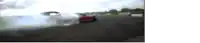 a blurred image of a red car drifting on a track