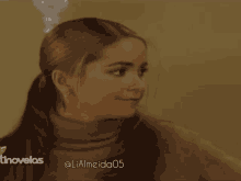a close up of a woman 's face with the name lialmeida05 below her