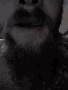 a close up of a person 's face covered in smoke