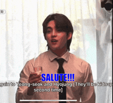 a man in a white shirt and tie is holding a glass of wine and saying salute