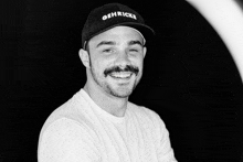 a man with a beard wearing a hat that says getricks