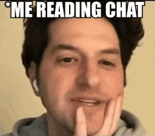 a man with his hand on his chin and a meme that says me reading chat