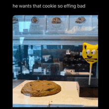 a picture of a cookie and a lollipop that says he wants that cookie so effing bad
