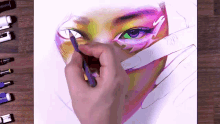 a close up of a person drawing a face with a pencil