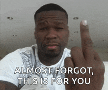 a man giving the middle finger with the words almost forgot this is for you below him