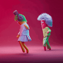 a cartoon character wearing headphones dancing with another character