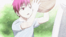 a boy with pink hair is holding a basketball in his hand