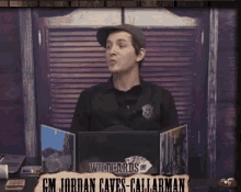 a man standing in front of a sign that says wildcards on it