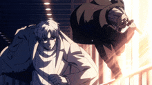 a man in a white suit is standing next to another man
