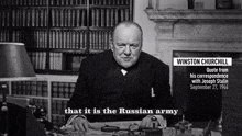 a man sits at a desk with a quote from winston churchill