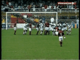 a group of soccer players are playing on a field and one of them has the number 5 on his back